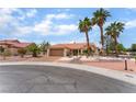 Inviting one-story home with a tile roof and desert landscaping for relaxed, low-maintenance living at 3109 Moongold Ct, Las Vegas, NV 89134