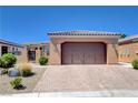A charming single-story home featuring a large brick paver driveway and two-car garage at 3616 Greenbriar Bluff Ave, North Las Vegas, NV 89081