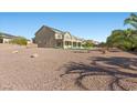 Spacious backyard with gravel landscaping, patio, and potential for outdoor enjoyment and customization at 7221 Harlow St, Las Vegas, NV 89131