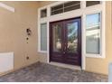 Elegant front door with glass panels and decorative accents, creating a welcoming entrance at 7221 Harlow St, Las Vegas, NV 89131