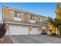 Home features an attached two-car garage and paved driveway, offering convenience and ample parking at 7221 Harlow St, Las Vegas, NV 89131