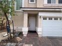 Inviting entryway featuring a brick walkway and a white front door at 7249 Linaria Rd, Las Vegas, NV 89113