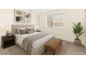 Inviting bedroom with a plush bed, neutral decor, and ample natural light at 7566 Glowing Ember Ct # 101, Las Vegas, NV 89130