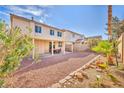 Spacious backyard featuring decorative rock landscaping and a covered patio area at 7886 Palace Monaco Ave, Las Vegas, NV 89117