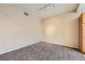 Inviting bedroom with neutral walls, carpet flooring and modern lighting at 830 Carnegie St # 824, Henderson, NV 89052