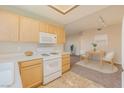Well-lit kitchen with white appliances and ample cabinet space at 830 Carnegie St # 824, Henderson, NV 89052