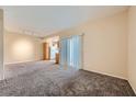 Spacious living room featuring neutral walls and plush carpeting at 830 Carnegie St # 824, Henderson, NV 89052