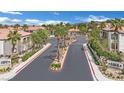 Street view of Horizons at Seven Hills featuring mature palm trees and well-manicured landscaping at 950 Seven Hills Dr # 124, Henderson, NV 89052