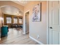 Open-concept living room with hardwood floors and an archway leading to the entryway at 9853 Bangalore Ct, Las Vegas, NV 89148