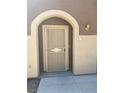 Inviting front entrance featuring a secure metal gate and overhead light fixture at 10190 Deerfield Beach Ave # 202, Las Vegas, NV 89129