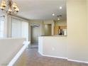 Open-concept living room featuring recessed lighting and a breakfast bar at 10190 Deerfield Beach Ave # 202, Las Vegas, NV 89129