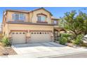 Charming two-story home with a three-car garage, desert landscaping, and a welcoming entrance at 1141 Brent Park Ct, Henderson, NV 89002