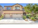 Two-story home features a three-car garage, well-maintained landscaping, and inviting curb appeal at 1141 Brent Park Ct, Henderson, NV 89002