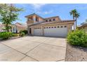 Attractive home boasting a spacious driveway and a three-car garage surrounded by mature landscaping at 1339 Echo Creek St, Henderson, NV 89052