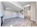 Inviting living room with a fireplace, high ceilings, and open staircase to the second floor at 208 Genesee Point St, Henderson, NV 89074
