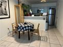 Cozy kitchen with stainless steel appliances, a breakfast bar, and a dining area at 2136 Bavington Dr # A, Las Vegas, NV 89108