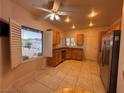 Open kitchen with stainless steel appliances, ample cabinetry, and a view to the exterior at 2504 Libretto Ave, Henderson, NV 89052