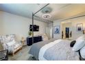Comfortable main bedroom featuring modern décor, sitting area, and closet access at 280 Via Del Duomo, Henderson, NV 89011