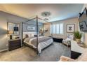 Well-lit main bedroom with a four-poster bed, plush carpeting, and contemporary furnishings at 280 Via Del Duomo, Henderson, NV 89011