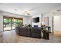 Cozy living room features sleek fireplace, contemporary furnishings and sliding glass doors to patio at 2862 Athens Ridge Dr, Henderson, NV 89052