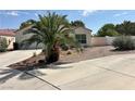 Charming single-story home featuring desert landscaping, a two-car garage and concrete driveway at 316 Lingering Ln, Henderson, NV 89012