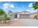 Inviting one-story home with a well-maintained front yard and a spacious two-car garage at 3228 Jumping Hills Ave, Henderson, NV 89052