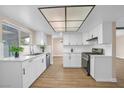 Bright kitchen featuring white cabinetry, stainless steel appliances, and quartz countertops at 4431 El Campana Way, Las Vegas, NV 89121