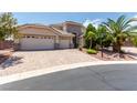Charming single-story home boasting a three-car garage and a beautifully paved driveway at 6779 Rainstorm Ridge Ave, Las Vegas, NV 89131