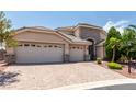 Charming single-story home boasting a three-car garage and a beautifully paved driveway at 6779 Rainstorm Ridge Ave, Las Vegas, NV 89131