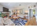 Relaxing living room with a cozy fireplace, stylish decor, and an open layout for entertaining at 7961 Lions Rock Way # 202, Las Vegas, NV 89128