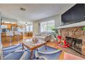 Inviting living area with a fireplace, eat-in kitchen, bar seating, and comfortable furnishings at 7961 Lions Rock Way # 202, Las Vegas, NV 89128