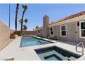 A stunning backyard featuring a pool and spa, perfect for relaxation and outdoor enjoyment at 8032 Deep Stone Ave, Las Vegas, NV 89149