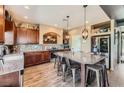 A gourmet kitchen featuring wood cabinets, stainless steel appliances, granite countertops, and a large center island at 8121 Russell Creek Ct, Las Vegas, NV 89139