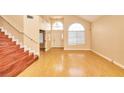 Bright, spacious living room with vaulted ceilings and beautiful hardwood floors at 9413 Cedar Heights Ave, Las Vegas, NV 89134