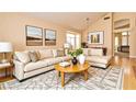 Comfortable living room featuring stylish furniture, neutral tones, and ample natural light at 9413 Cedar Heights Ave, Las Vegas, NV 89134