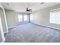 Spacious carpeted bedroom featuring multiple windows that fill the room with natural light at , Las Vegas, NV 89148