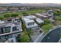 Luxury home aerial view, highlighting modern architecture and desert landscaping near the golf course at 1337 Villa Barolo Ave, Henderson, NV 89052