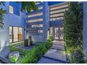 Modern home entryway featuring a water feature, ample light, and a minimalist aesthetic at 1337 Villa Barolo Ave, Henderson, NV 89052