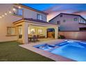 Backyard featuring a pool, hot tub, covered patio with furniture, and privacy wall at 404 Lost Horizon Ave, Henderson, NV 89002