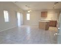 Bright living room boasts tile flooring, neutral walls, and abundant natural light at 4718 Victoria Garden Ave, North Las Vegas, NV 89031