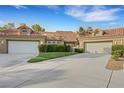 Attractive home with a well-maintained lawn and a three-car garage, offering ample parking at 5008 Shoal Creek Cir, Las Vegas, NV 89113