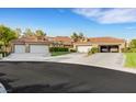 Spacious home with a three-car garage and a well-manicured front yard at 5008 Shoal Creek Cir, Las Vegas, NV 89113