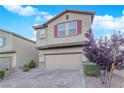 Charming two-story home featuring desert landscaping and a two-car garage at 5503 Jinan St, Las Vegas, NV 89148