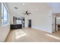 Bright, open-concept space with hardwood floors, modern ceiling fan and lots of natural light at 5834 Autumn Harvest Ave, Las Vegas, NV 89142