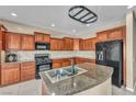 Well-equipped kitchen features granite countertops, stainless steel appliances, and ample cabinet space at 5992 Quintillion Ave, Las Vegas, NV 89122