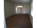 Spacious living room with carpeting, neutral walls, and sliding doors leading to the backyard at 6143 Majestic Wind Ave, Las Vegas, NV 89122