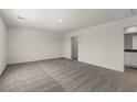 Neutral bedroom featuring carpet floors, white walls, and a bright window at 6185 Blood Lily Ave, Las Vegas, NV 89122