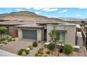 Beautiful single-story residence with mountain views and an attractive exterior featuring landscaping at 6865 Steel Mist St, Las Vegas, NV 89148