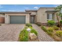 Inviting single-story home featuring a well-maintained front yard and a welcoming entrance path at 6865 Steel Mist St, Las Vegas, NV 89148