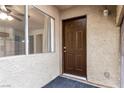 Inviting entryway featuring a solid front door, sidelight window, and neutral tones at 848 Hedge Way # 5, Las Vegas, NV 89110
